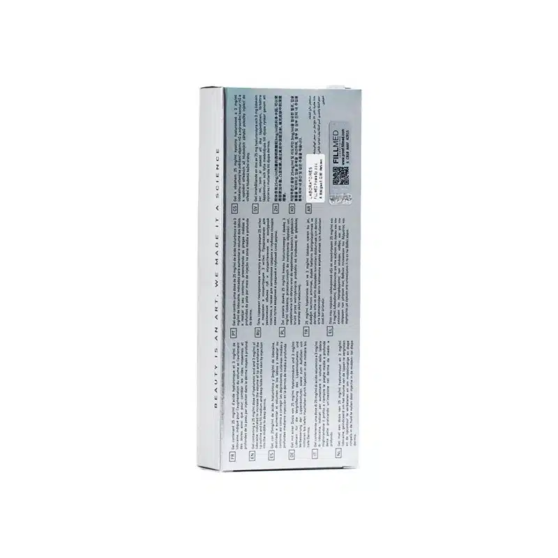 A rectangular FILLMED® ART FILLER LIPS SOFT with Lidocaine box with text and symbols on the back. The box is mostly white with a gray section and various instructions or details printed on it. There is a QR code and a barcode near the top right corner.