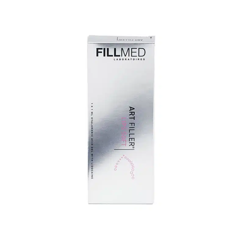 A silver and white rectangular box labeled "FILLMED® ART FILLER LIPS SOFT with Lidocaine." The box includes text indicating it contains 1 x 1ML of hyaluronic acid for aesthetic treatments, along with a small abstract design towards the bottom.