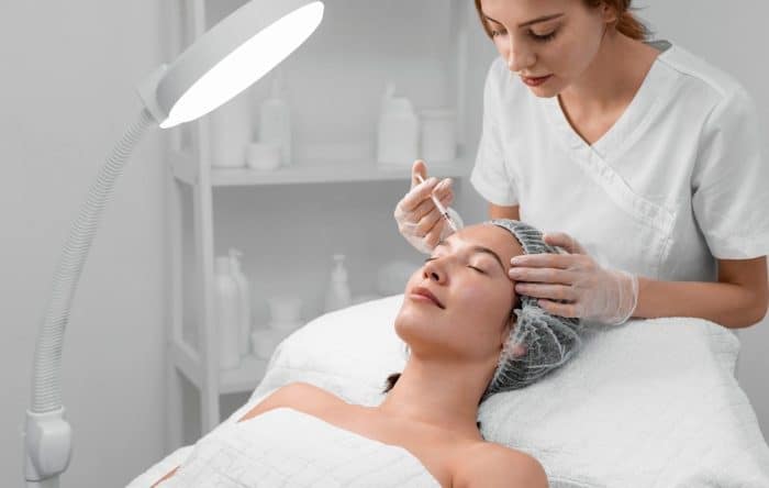 Female patient receiving Dysport injections in an aesthetic clinic.