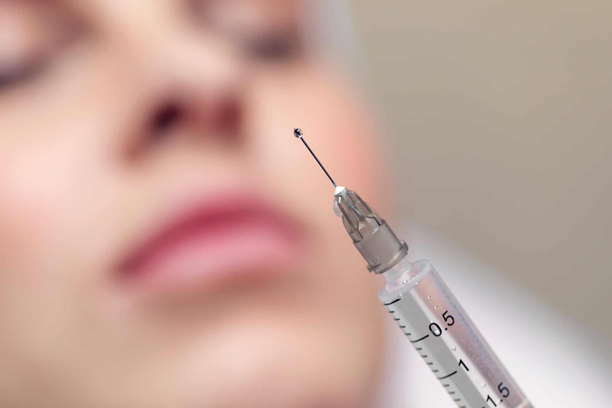 Close-up shot of a needle from an injection in an aesthetic clinic.