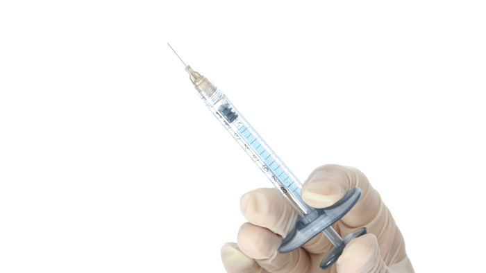 Doctor with injection. 