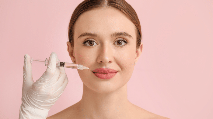 Woman getting facial augmentation. 