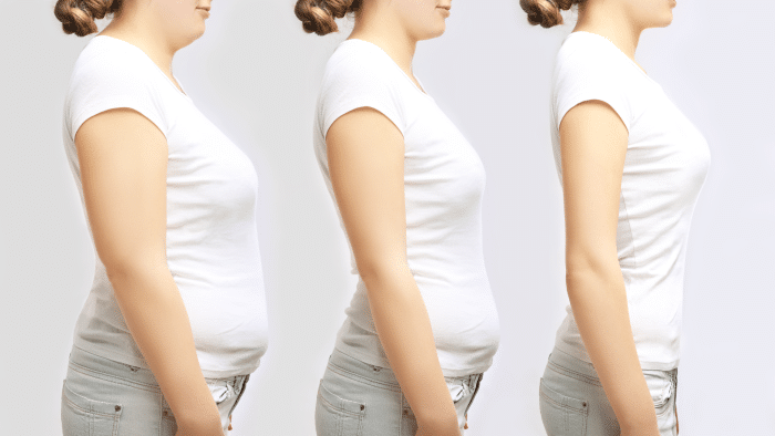 A side-by-side view of three women standing in profile. Each woman is wearing a white t-shirt and light-colored jeans. The first woman has a slouched posture, the second is slightly more upright, and the third stands with perfect posture.