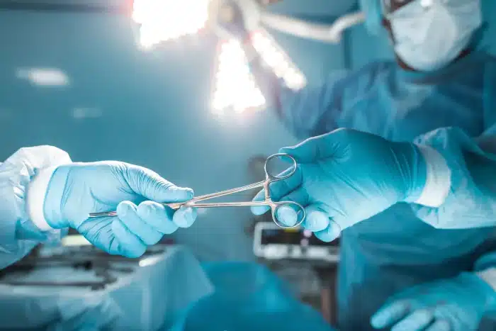 closeup shot from the plastic surgery OR, showcasing surgeons exchanging medical instruments