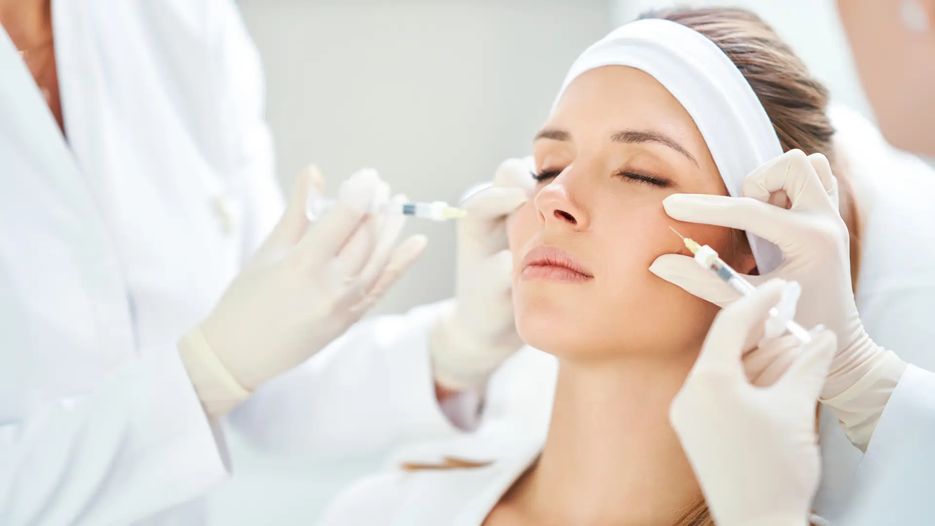 A female patient receives facial rejuvenation treatment using injectable products.
