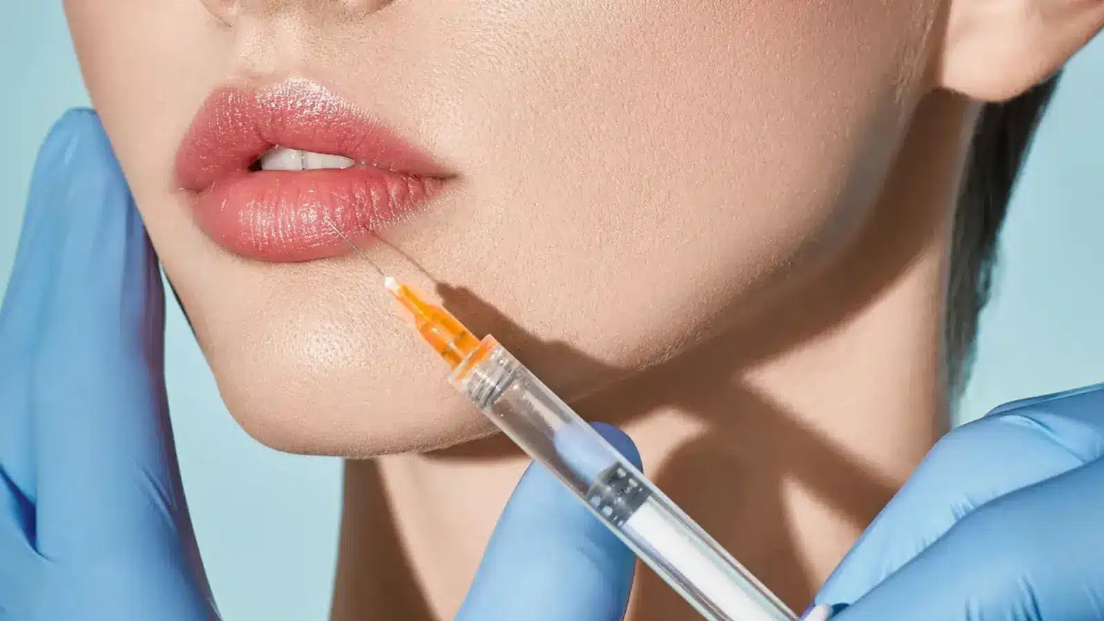 Woman with injection near her lips. 