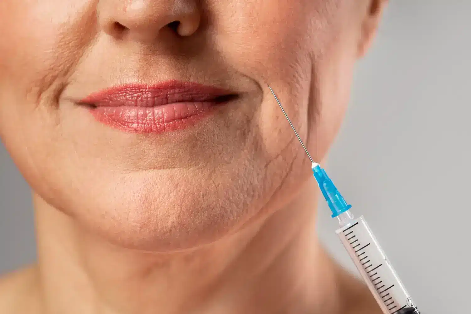 Woman getting facial injection.