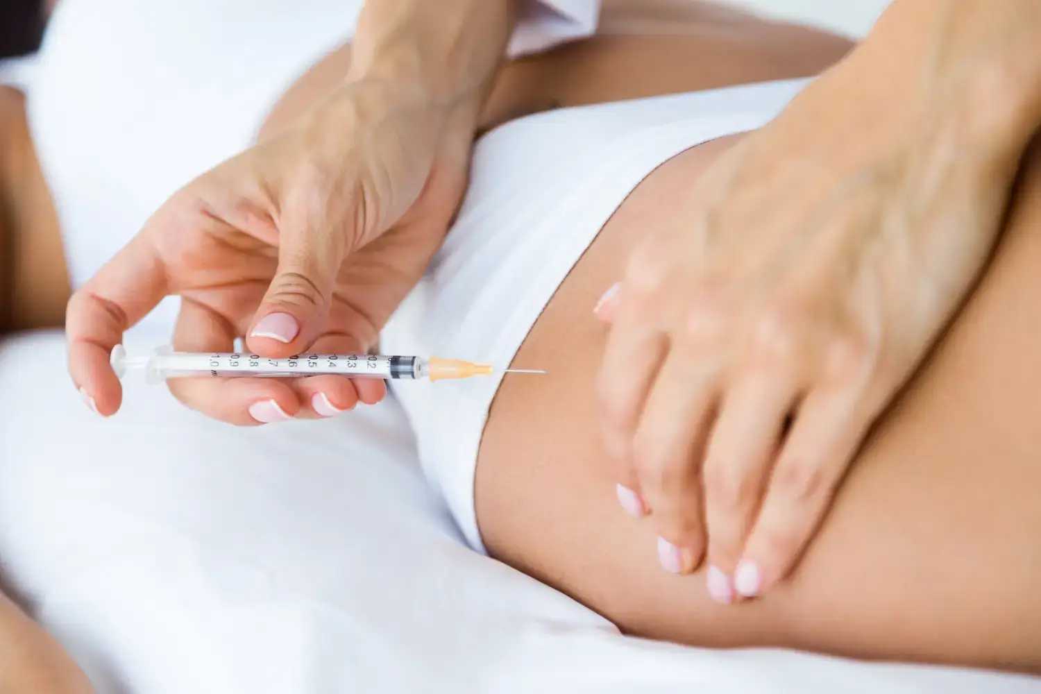 Person getting thigh injection.