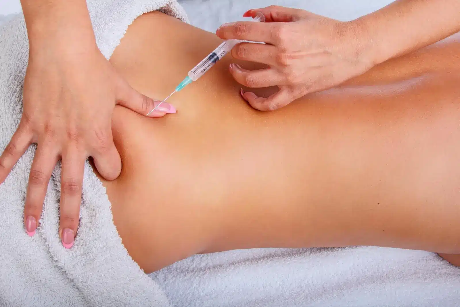 Person getting buttocks injection.