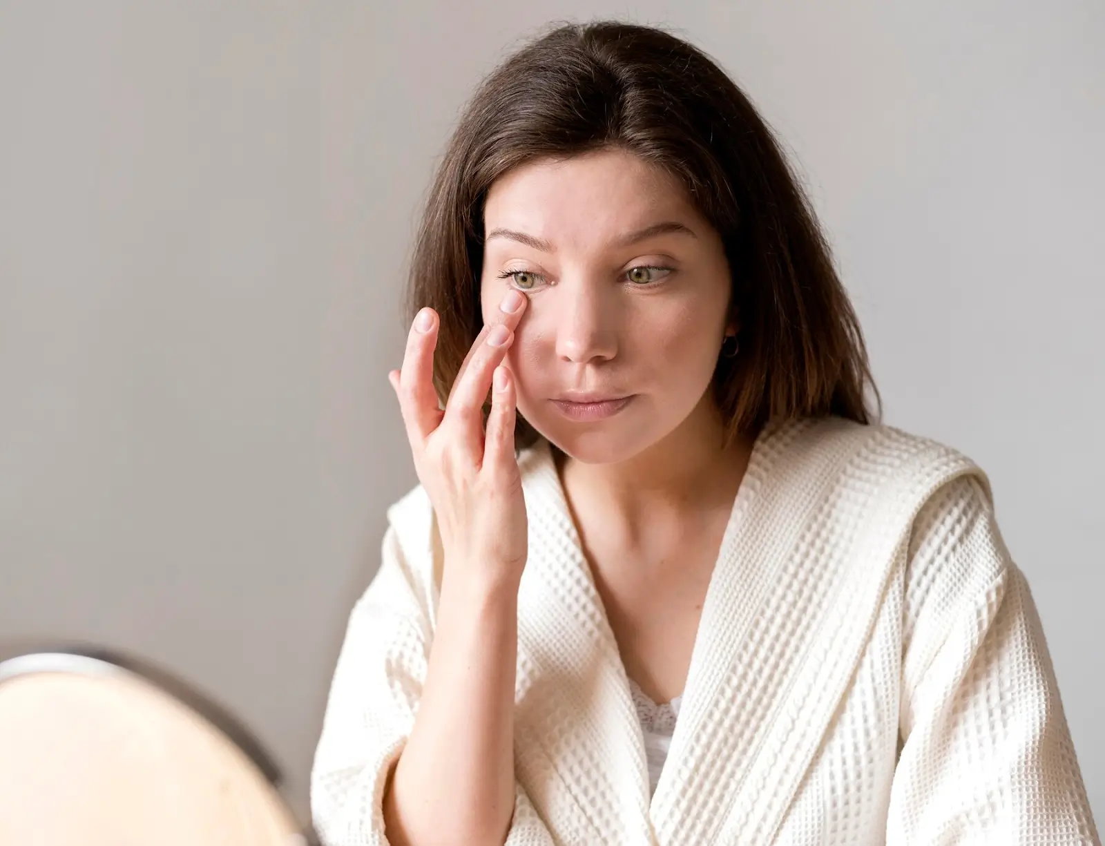 Person with an irritated eye.