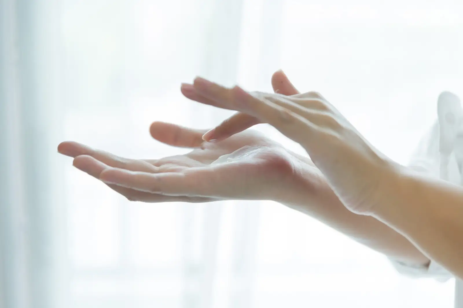 Cream on hands. 