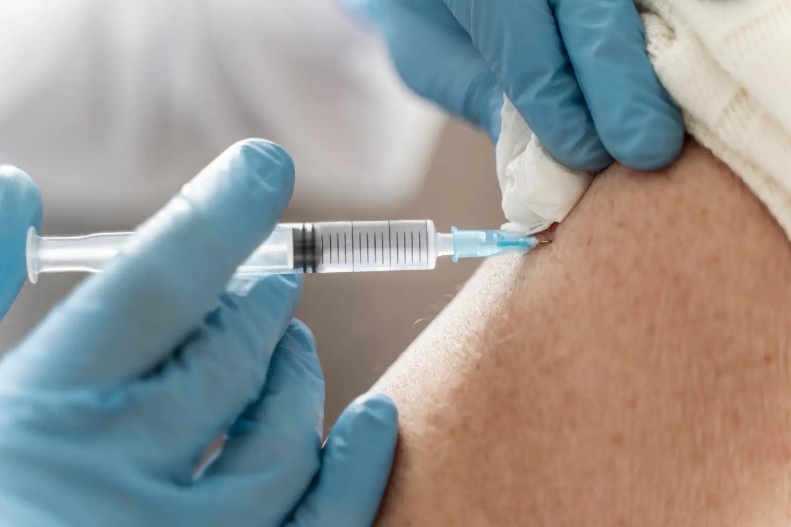 Person getting an injection.