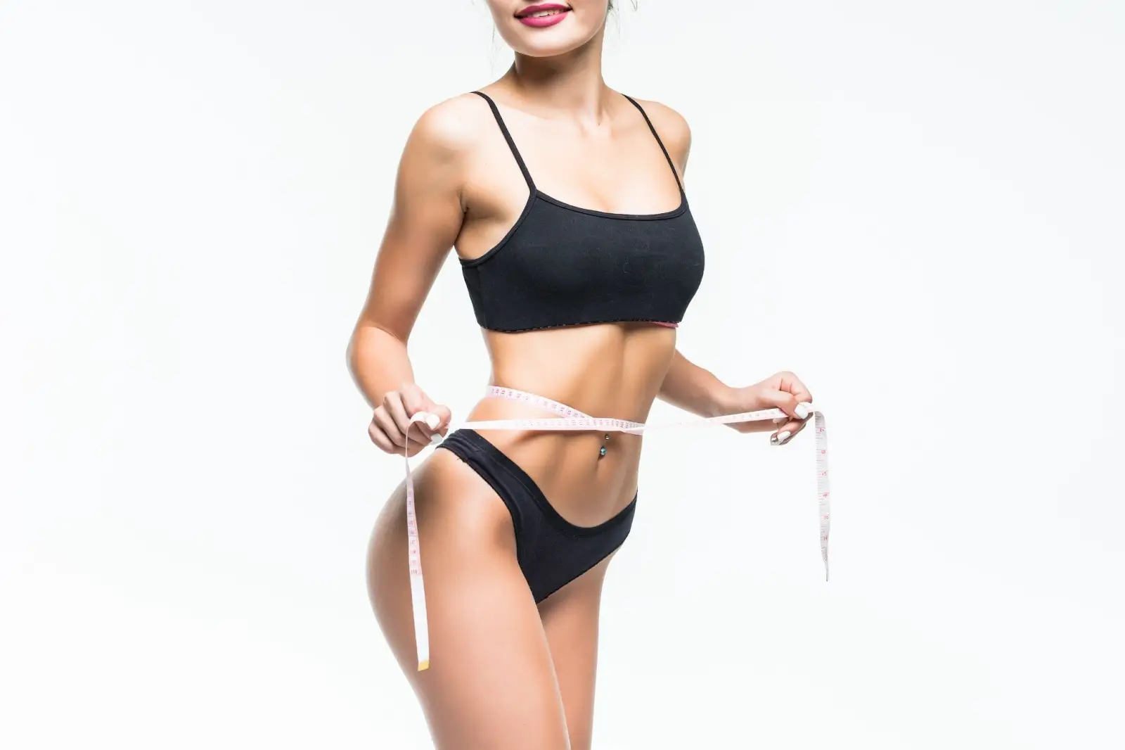 Person measuring her hips.

