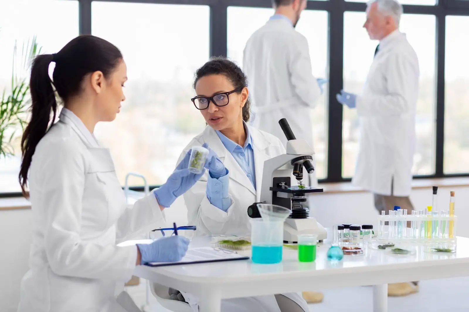 People talking in the lab.