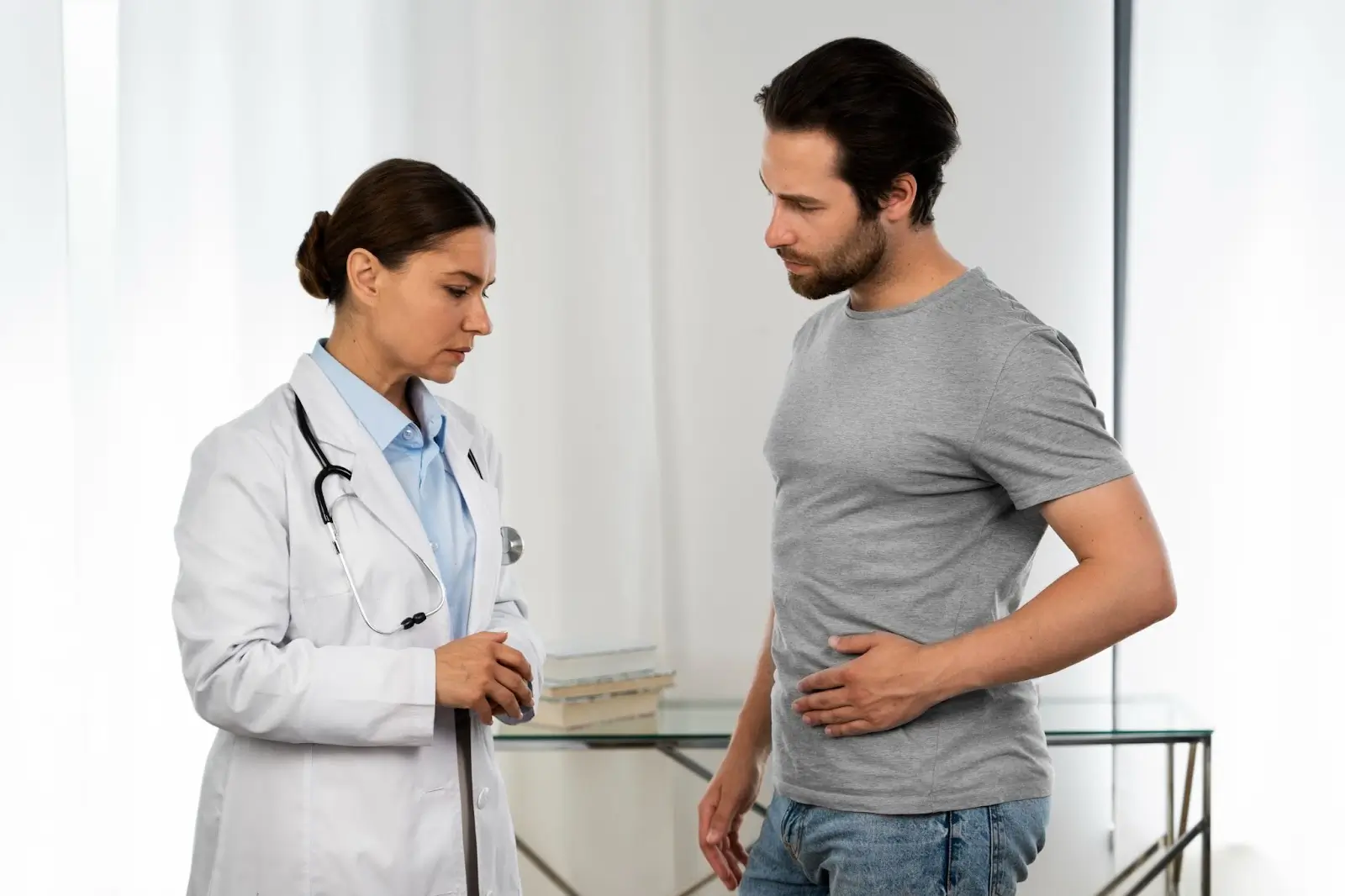 Man checking in with doctor. 