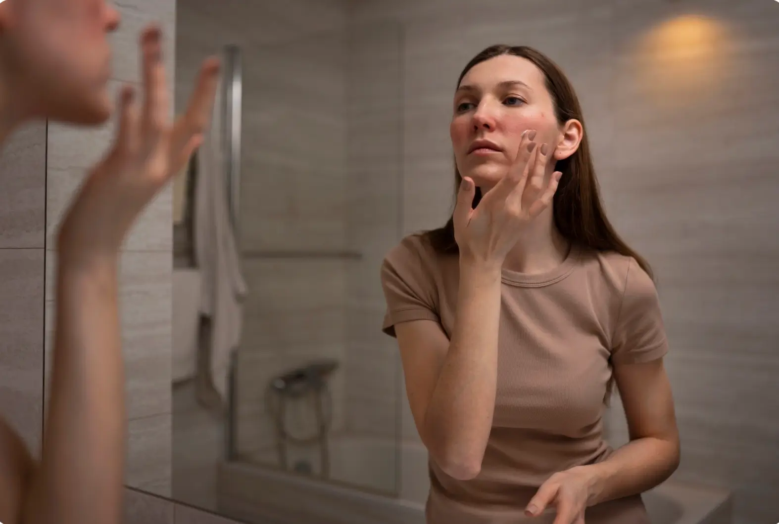 Woman experiencing redness across her skin after PRX T33 treatment.
