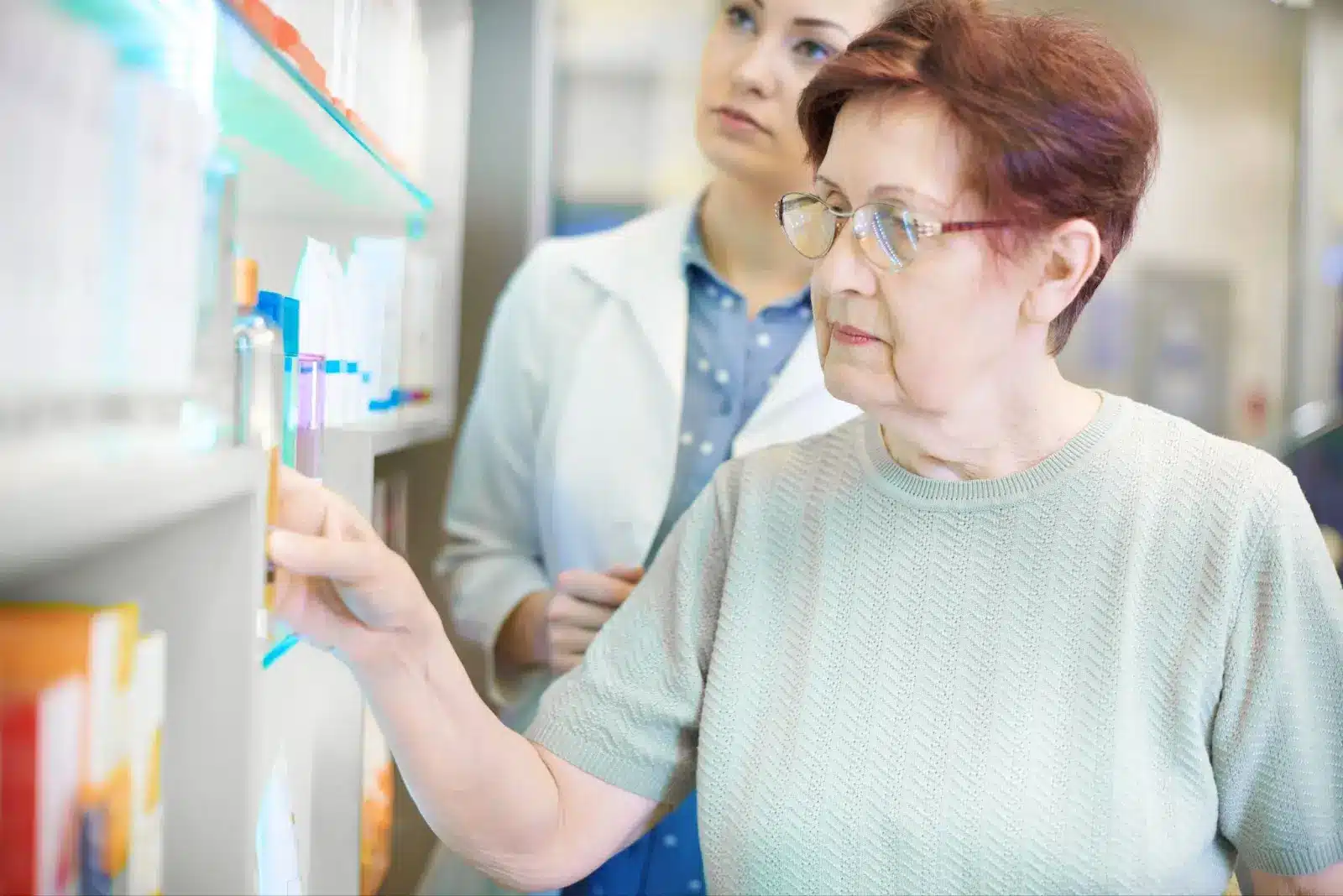 Person looking at the medications. 
