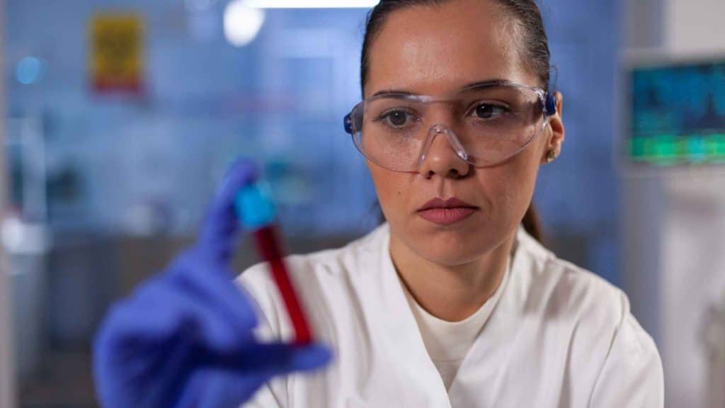 Laboratory scientist analyzing blood samples during a pharmacokinetic drug study
