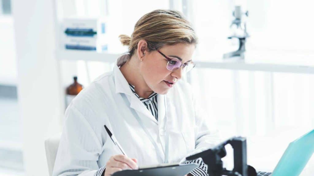 Medical professional reviewing retatrutide regulatory and clinical trial data on a computer