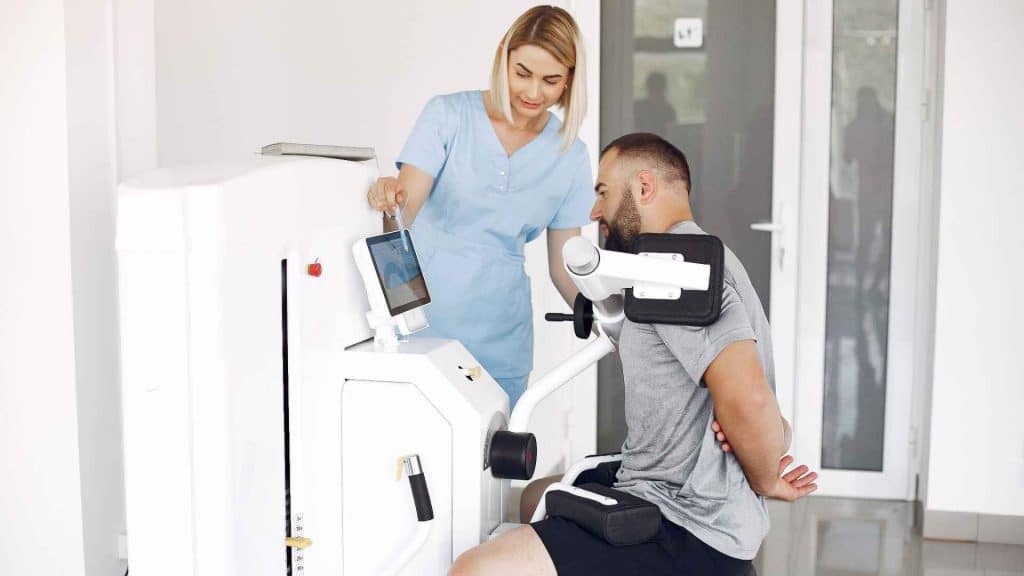 Adult participant undergoing a DEXA body composition scan during a clinical research assessment